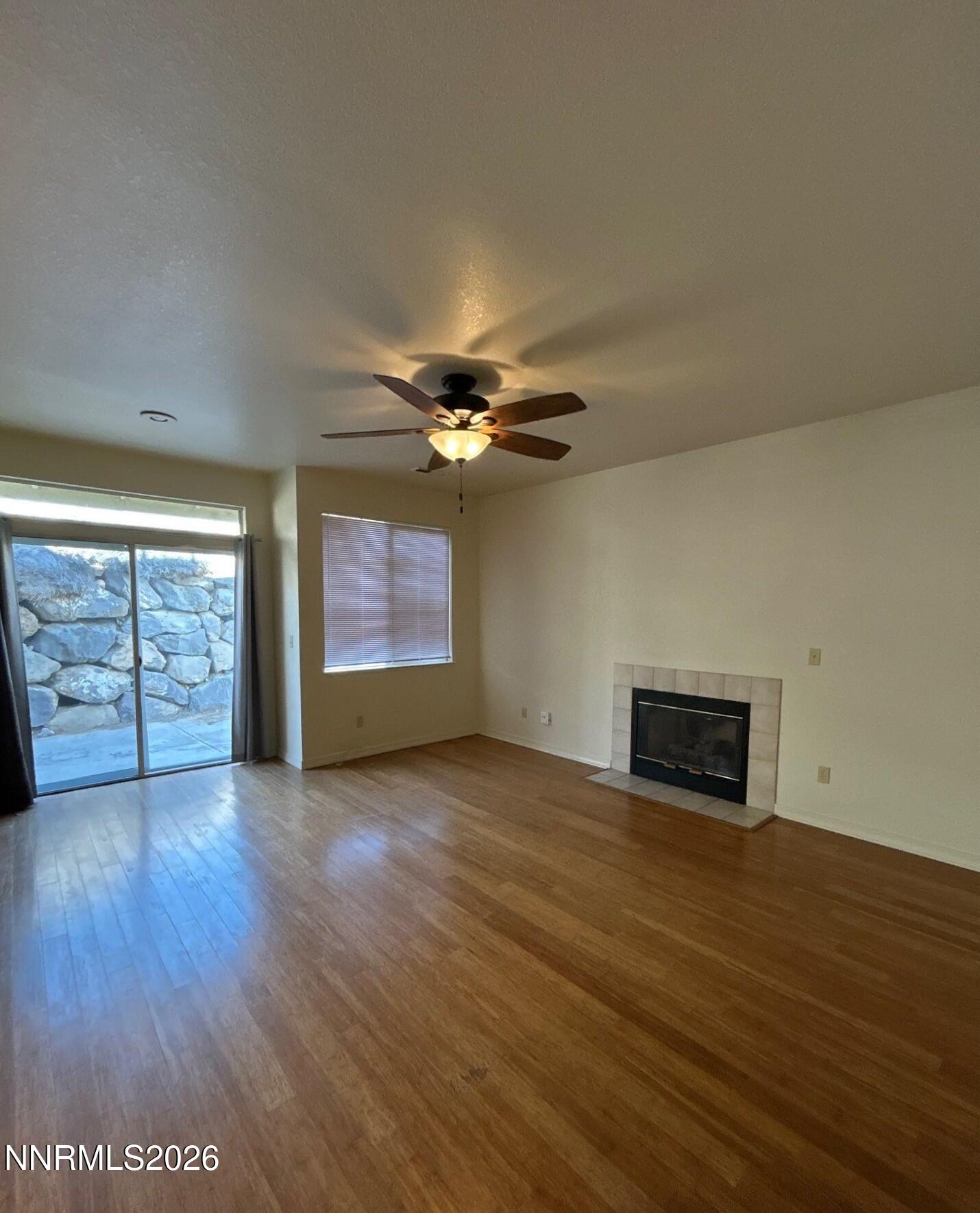 3951 Aspendale Drive Reno, NV 89503 - Photo 7 of 22 an empty room with wooden floor closet and windows