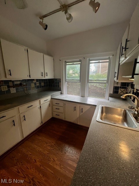 2915 Ludlow Road Cleveland, OH 44120 - Photo 15 of 50 Kitchen with tasteful backsplash, white cabinets, and track lighting