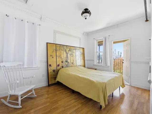 a bedroom with a bed and a chair