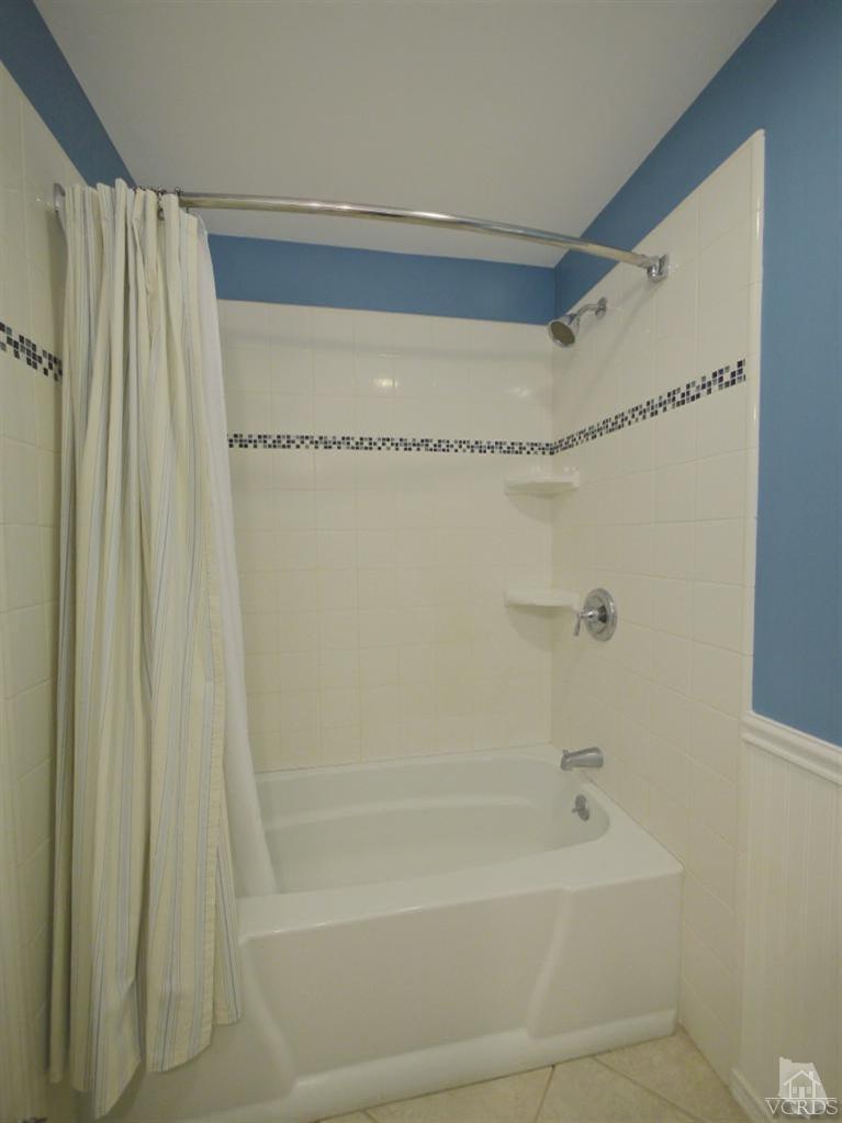 13421 Laurelhurst Road Moorpark, CA 93021 - Photo 16 of 28 a bathroom with a shower and a bath tub