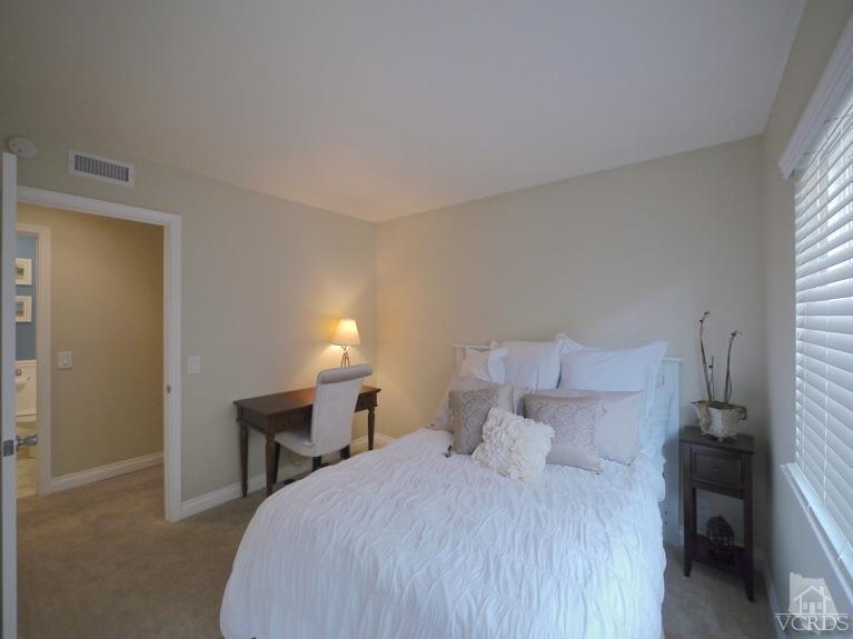 13421 Laurelhurst Road Moorpark, CA 93021 - Photo 18 of 28 a bed room with a bed and a chair