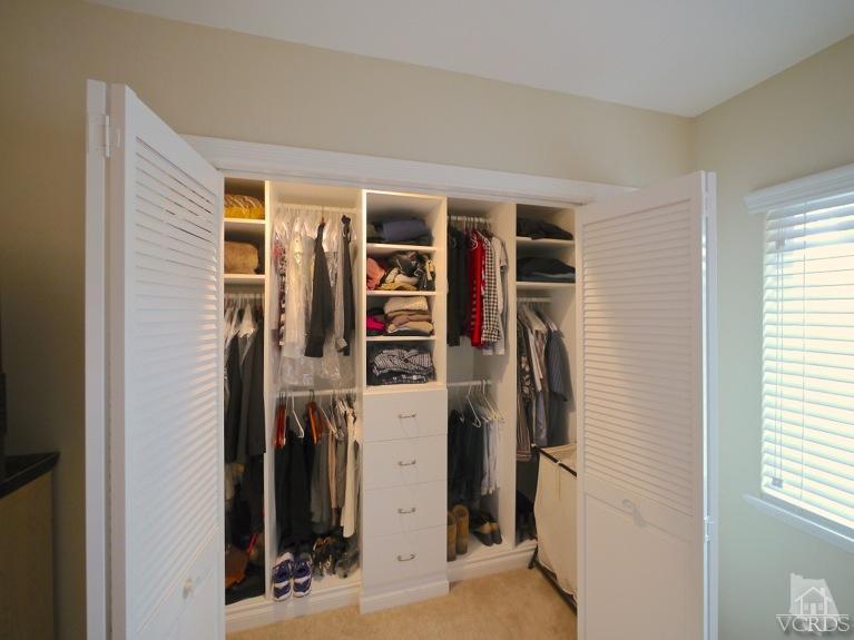 13421 Laurelhurst Road Moorpark, CA 93021 - Photo 23 of 28 a view of walk in closet with clothes and shoes