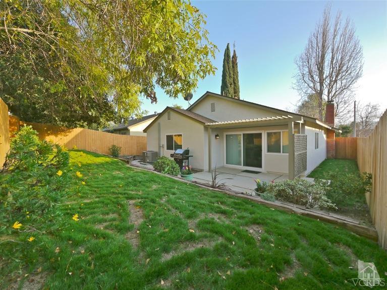 13421 Laurelhurst Road Moorpark, CA 93021 - Photo 27 of 28 a view of a house with a yard and a garden