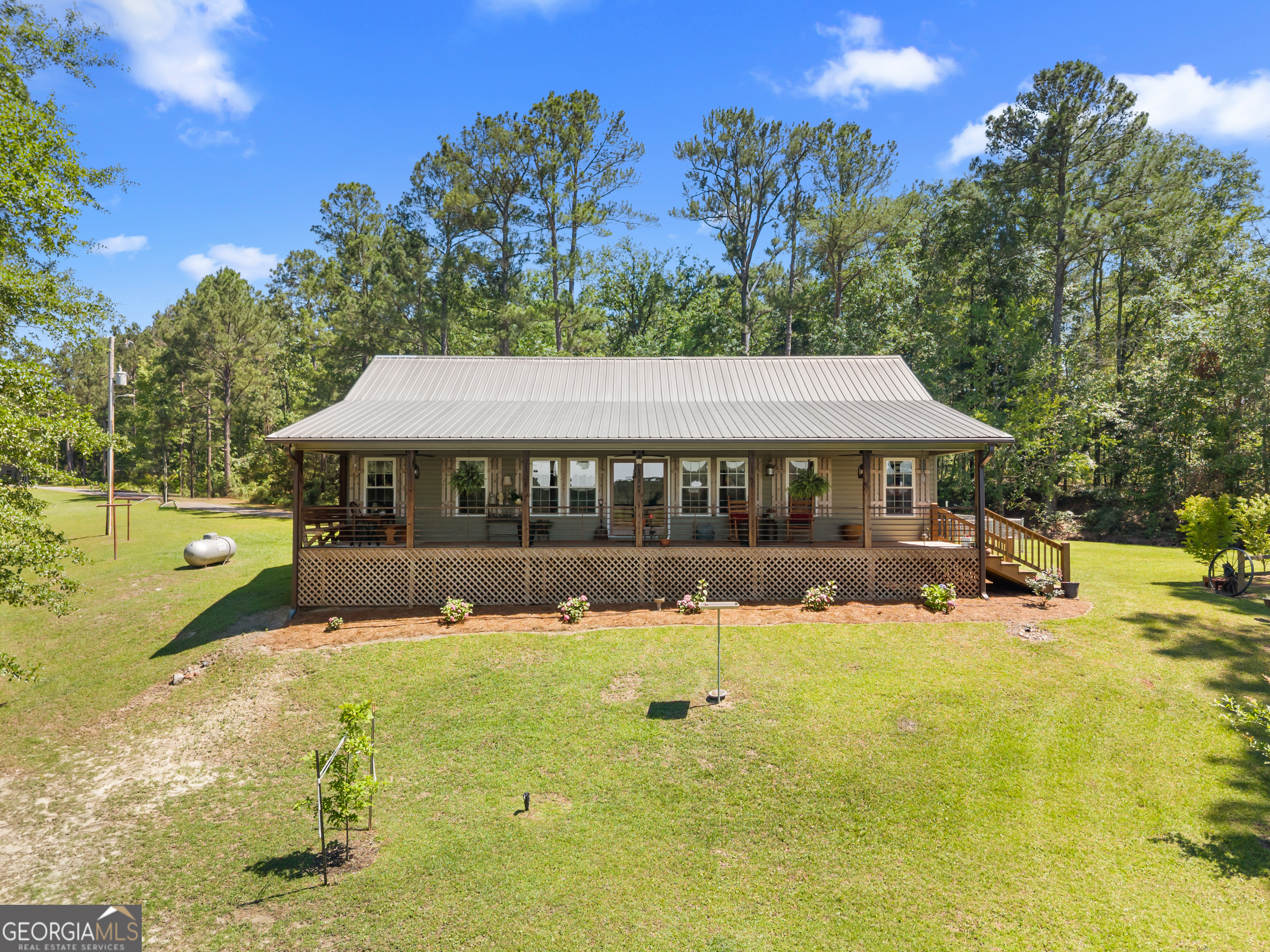418 Oglesby Pond Road Portal, GA 30450 - Photo 6 of 84 a view of a house with a yard
