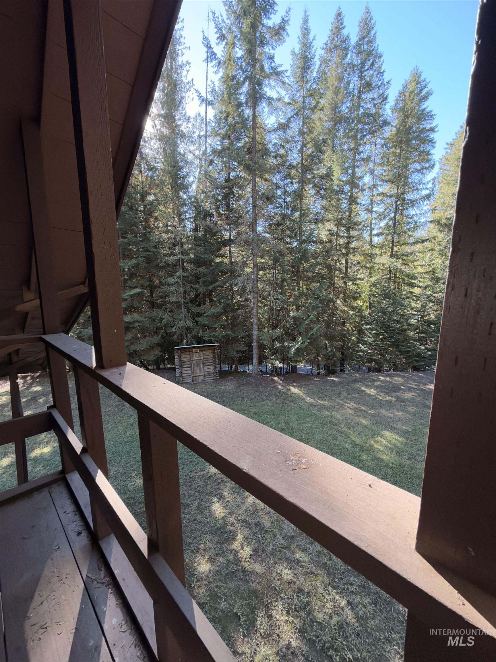 687 Big Cedar Road Kooskia, ID 83539 - Photo 4 of 37 Elevated balcony with wood railing, wood-plank flooring, and expansive natural scenery