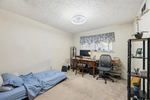 a workspace with furniture and a window