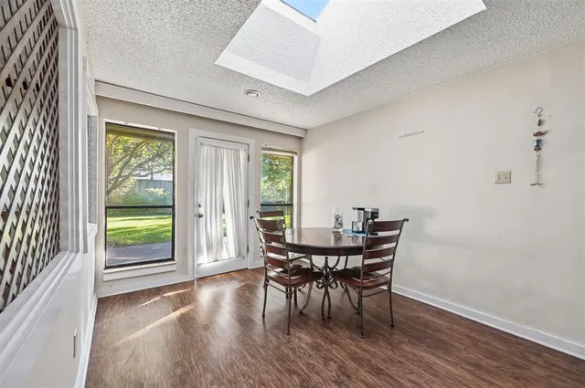 a view of a dining room with furniture and window