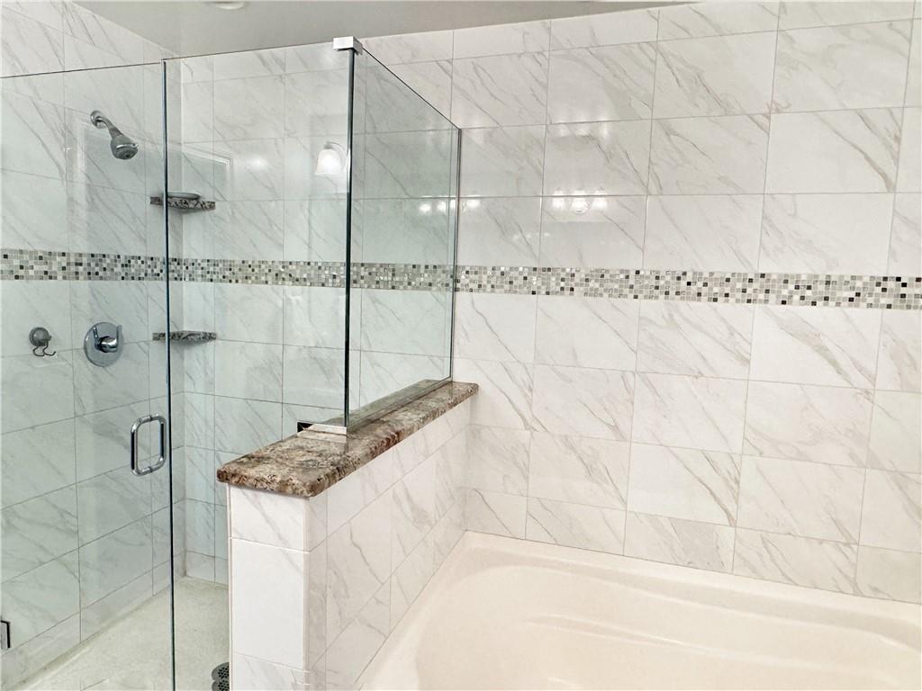 67 Nicholas Drive Beaver, PA 15009 - Photo 15 of 27 a bathroom with a bathtub and shower