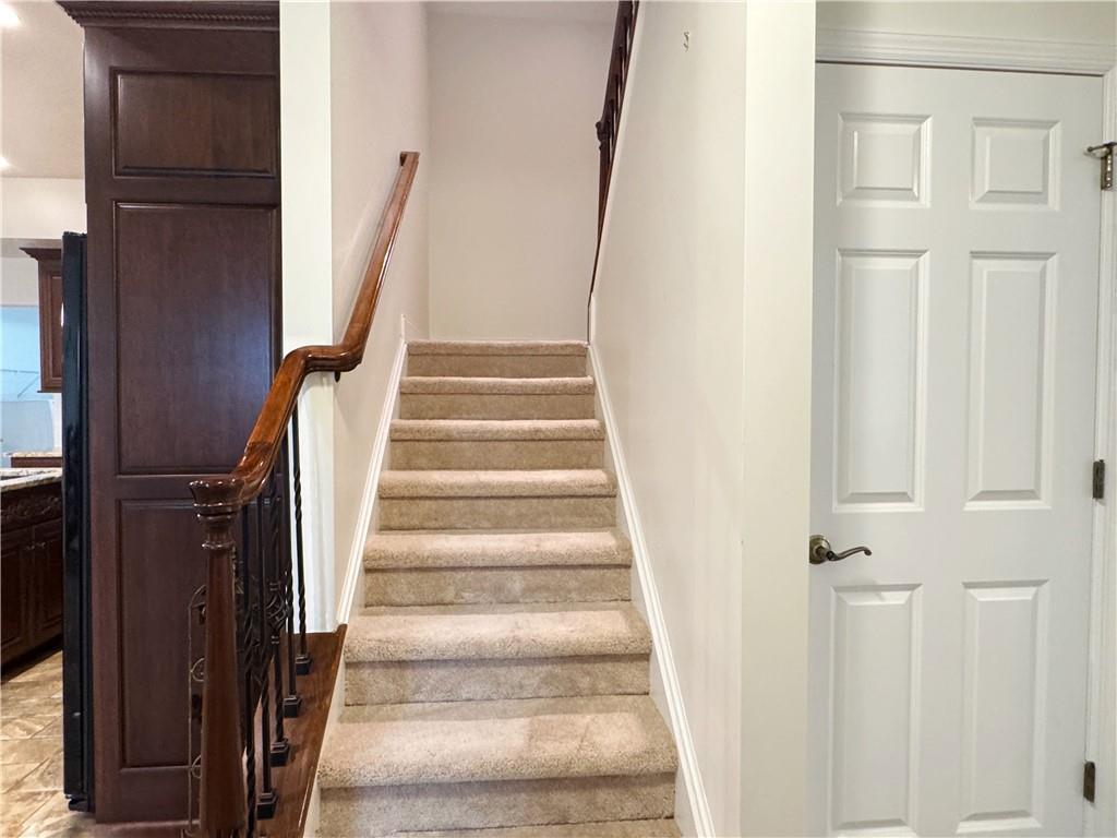 67 Nicholas Drive Beaver, PA 15009 - Photo 20 of 27 a view of staircase with white walls and a window