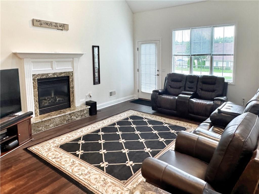 67 Nicholas Drive Beaver, PA 15009 - Photo 4 of 27 a living room with furniture a flat screen tv and a fireplace