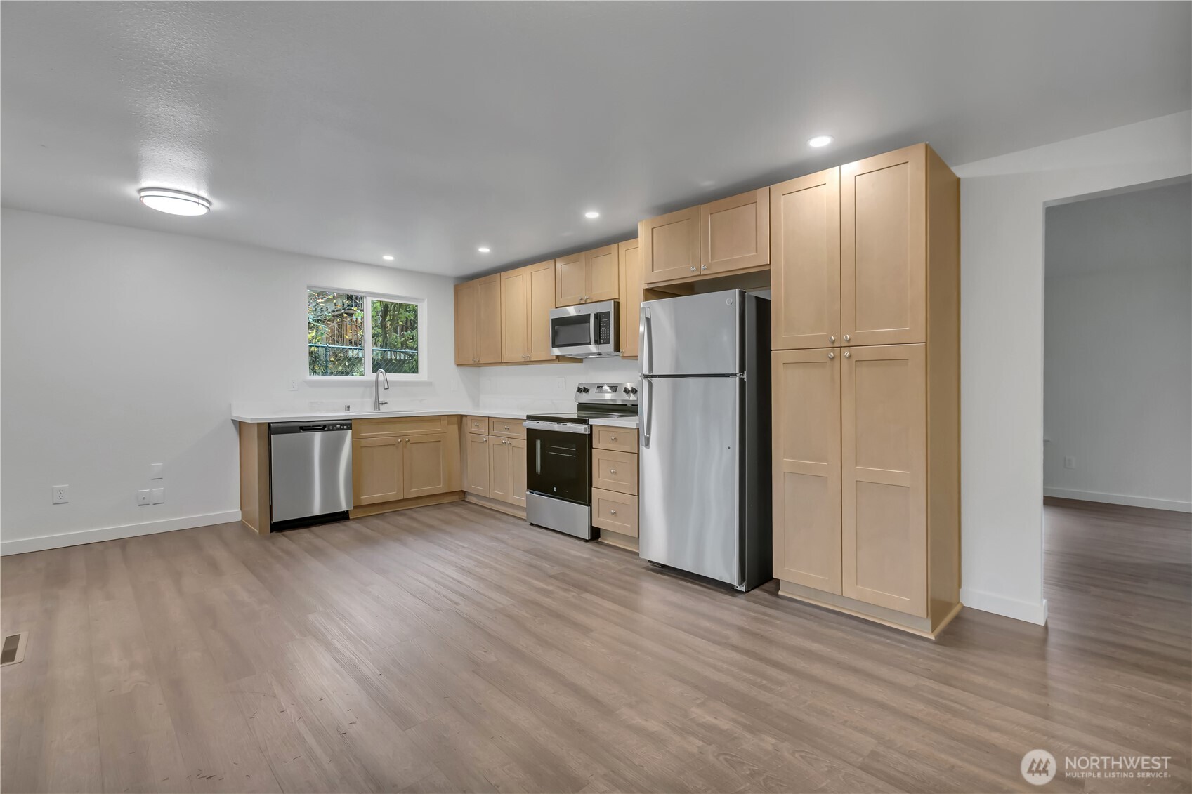 2728 Natalie Lane Steilacoom, WA 98388 - Photo 4 of 23 a kitchen with a refrigerator and a stove top oven