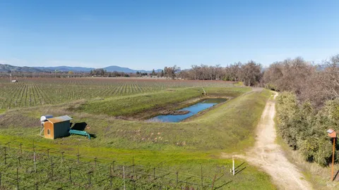 a view of a lake with a yard