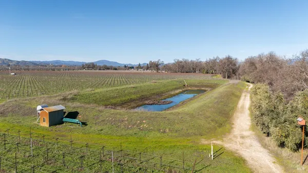 a view of a lake with a yard
