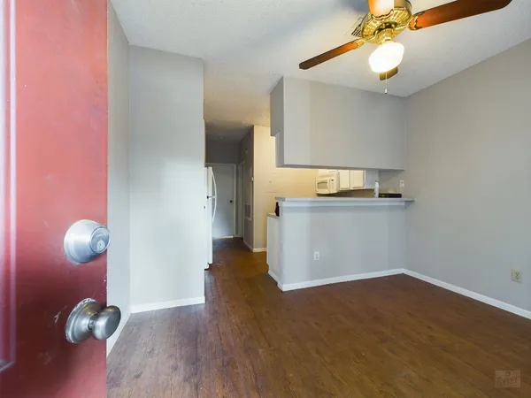 a view of a kitchen with a sink and cabinets