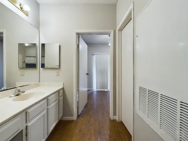 a bathroom with a sink and mirror
