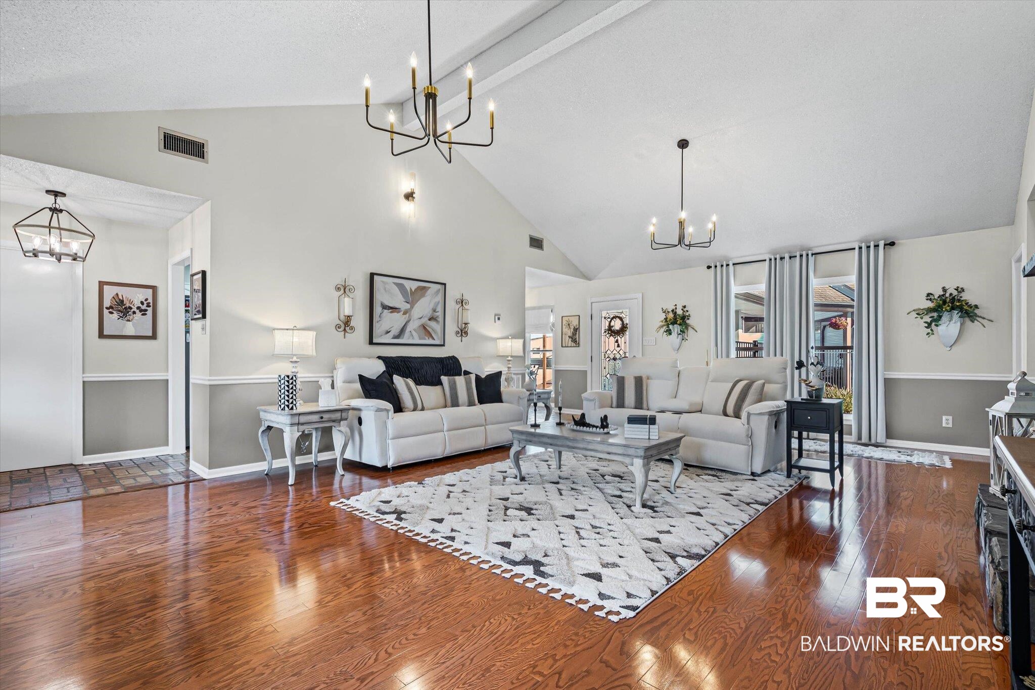 4567 Pine Avenue Saraland, AL 36571 - Photo 5 of 48 Living area with a chandelier, dark wood-style flooring, beam ceiling, and high vaulted ceiling