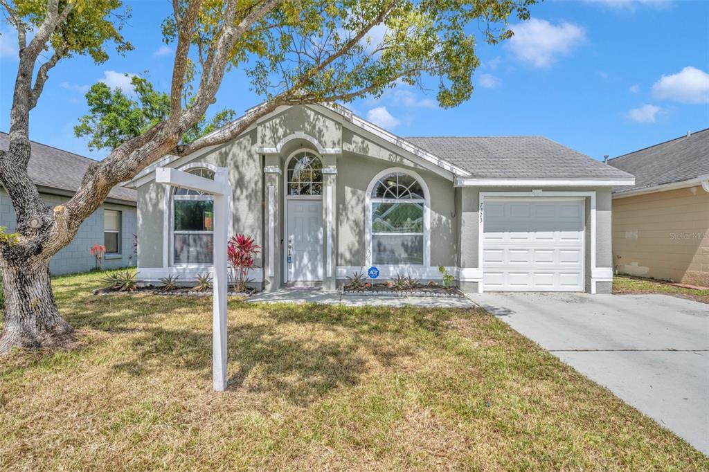 7323 R J Cove Court Orlando, FL 32822 - Photo 1 of 1 a view of a house with a yard