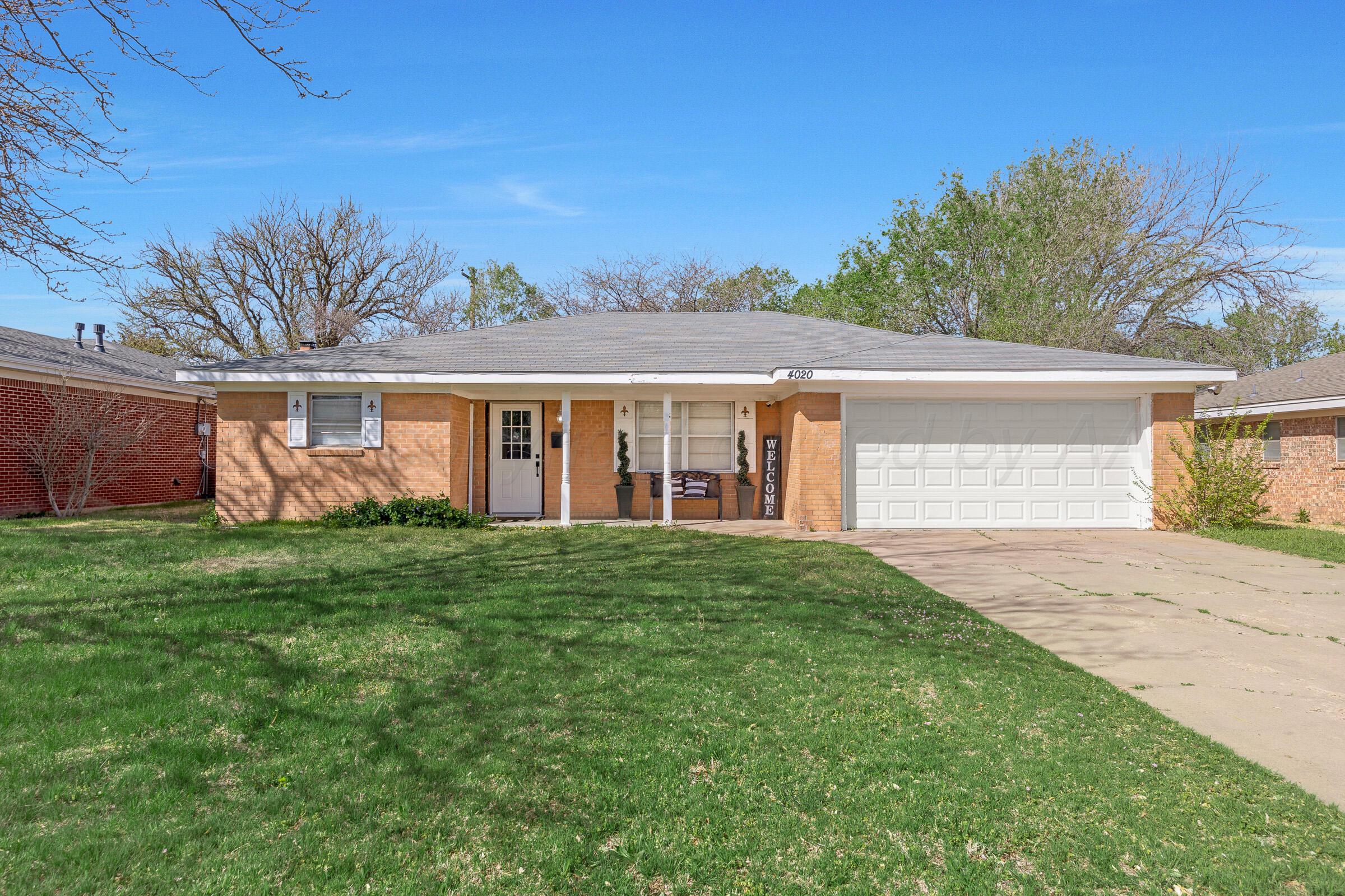 4020 Tulane Drive Amarillo, TX 79109 - Photo 1 of 23 a front view of a house with garden
