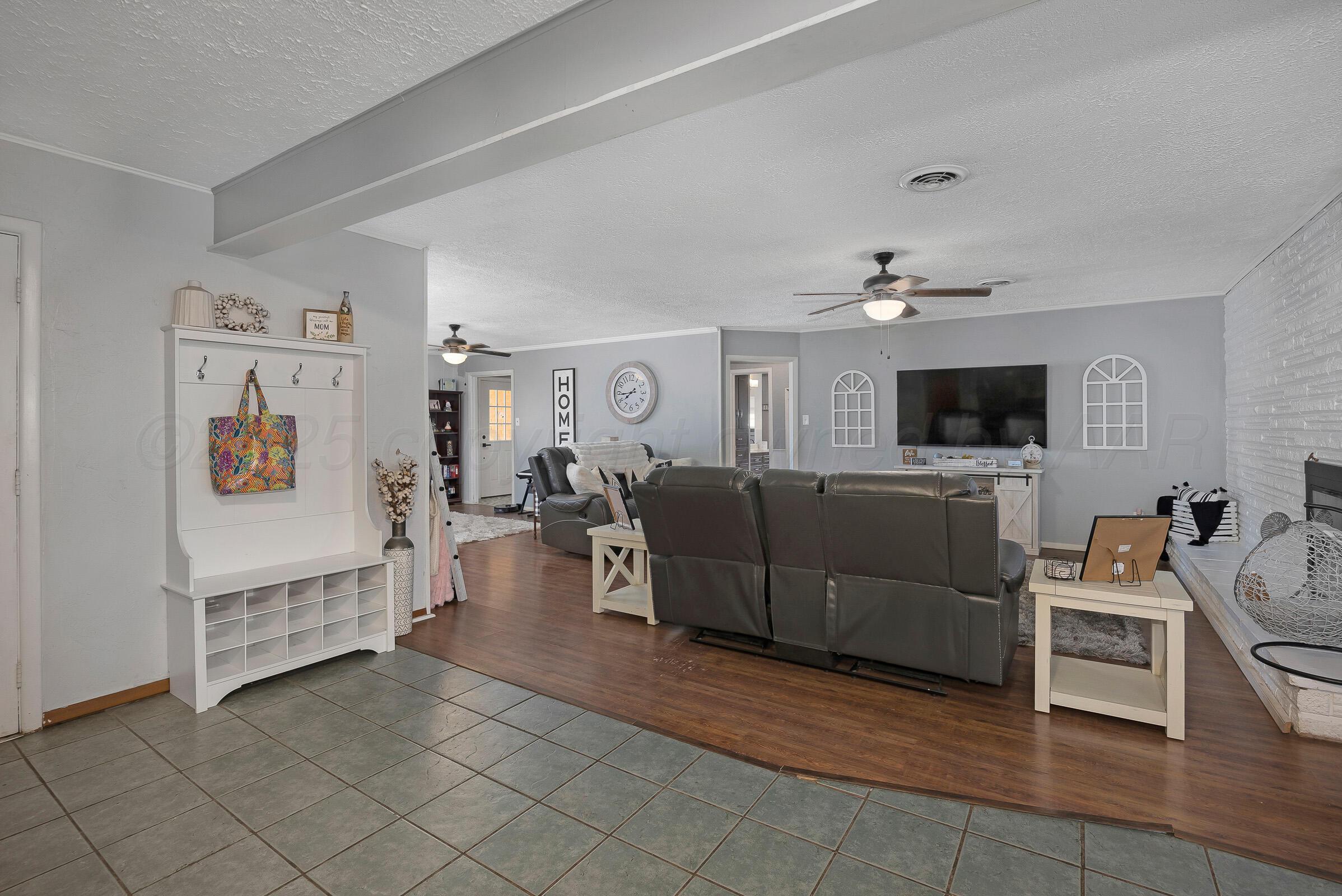 4020 Tulane Drive Amarillo, TX 79109 - Photo 12 of 23 a living room with furniture and a flat screen tv