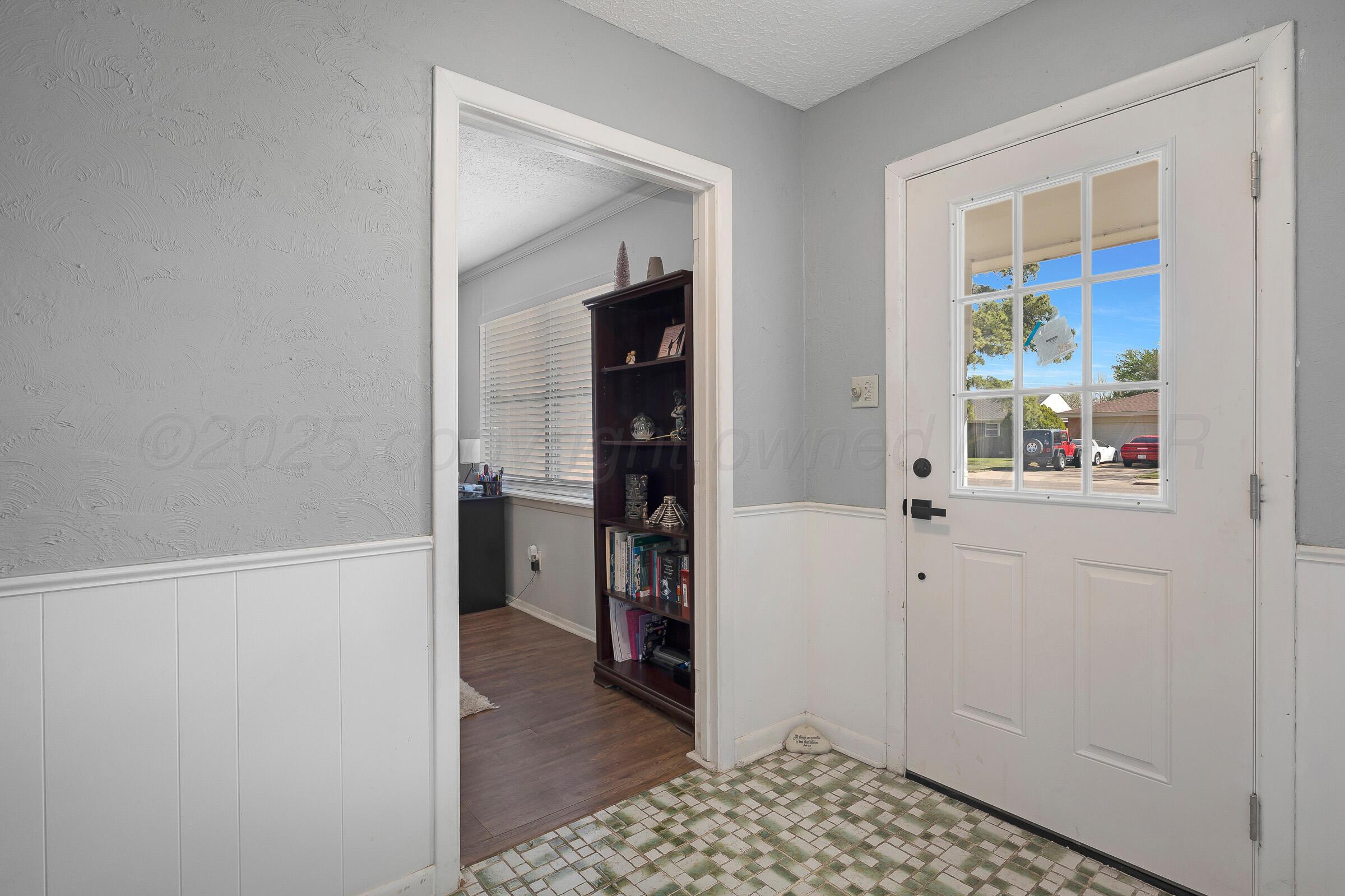 4020 Tulane Drive Amarillo, TX 79109 - Photo 20 of 23 a view of a hallway with wooden floor and closet