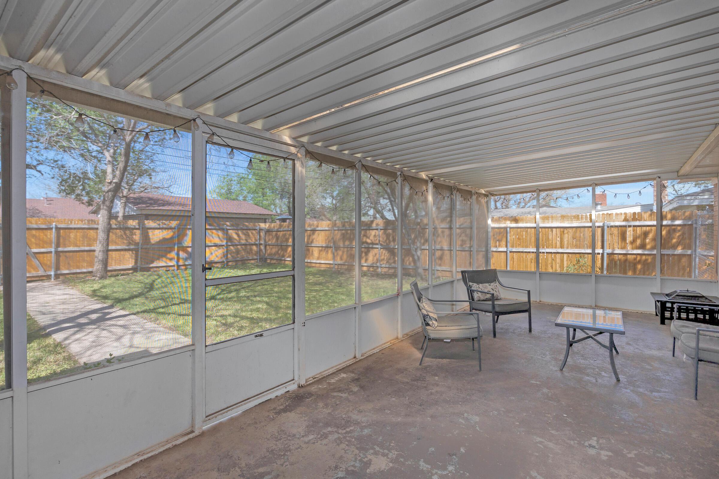 4020 Tulane Drive Amarillo, TX 79109 - Photo 21 of 23 a living room with furniture and a floor to ceiling window