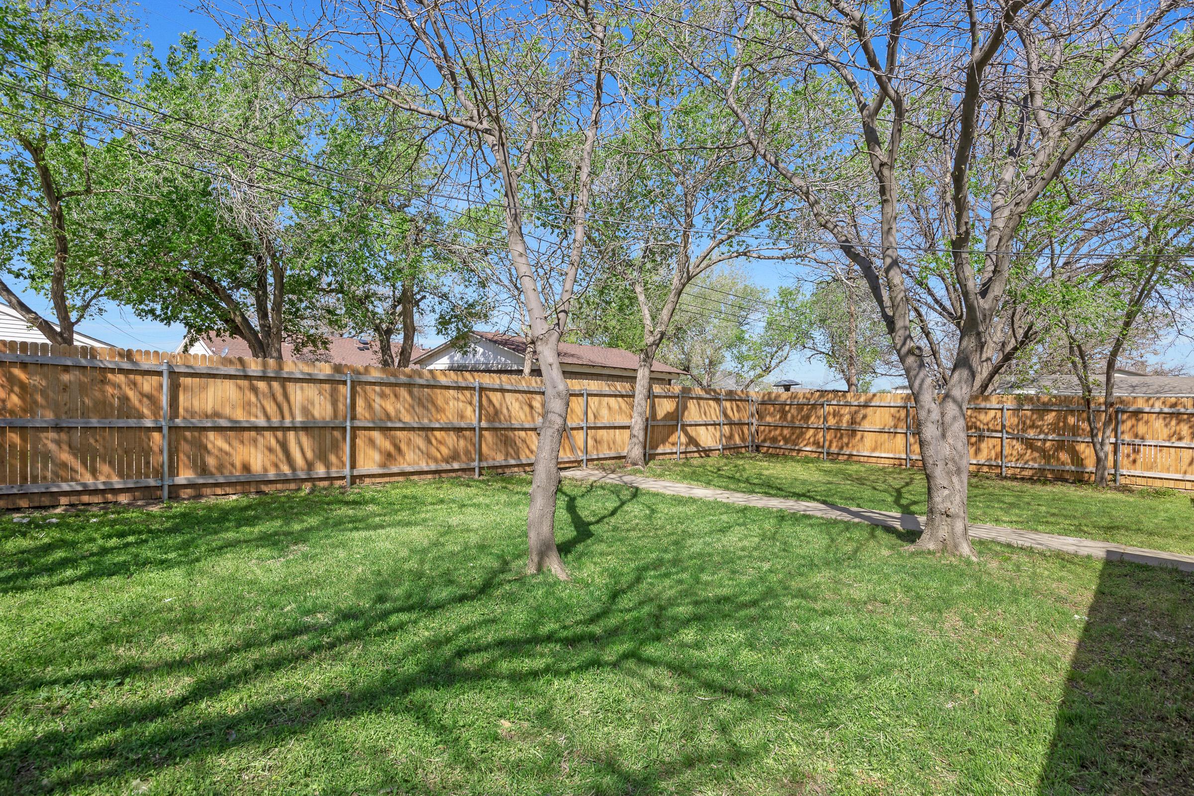 4020 Tulane Drive Amarillo, TX 79109 - Photo 23 of 23 a view of yard with tree and wooden fence