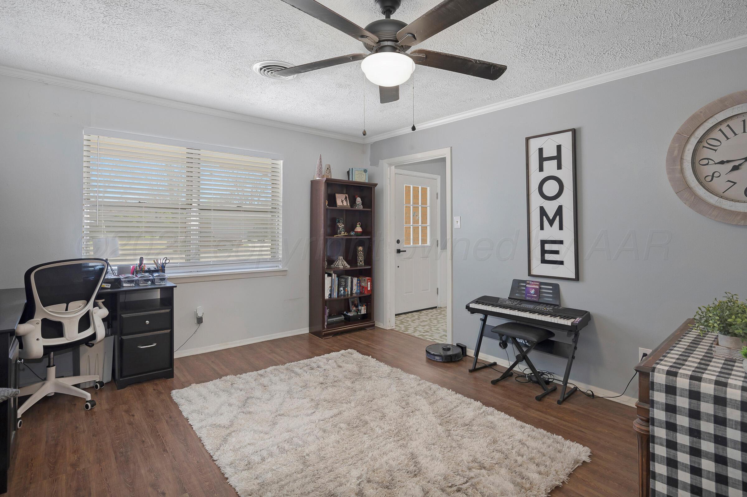 4020 Tulane Drive Amarillo, TX 79109 - Photo 7 of 23 a view of a workspace with furniture and a window
