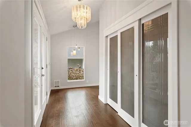 a view of a livingroom with wooden floor