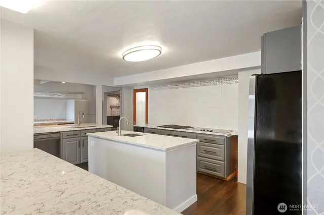 a kitchen with a sink stove and refrigerator