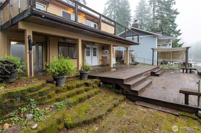 front view of a house with a wooden deck