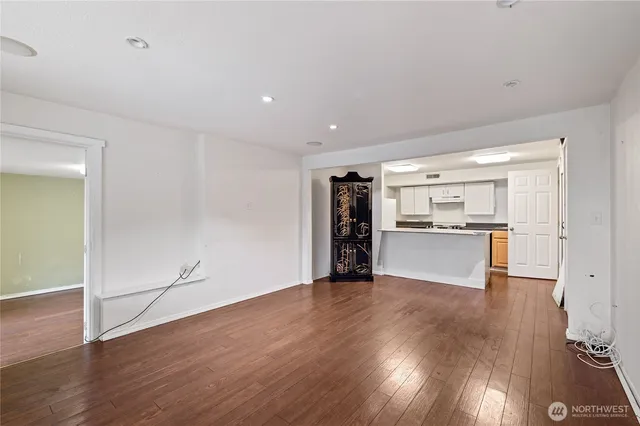 a view of a kitchen cabinets and wooden floor