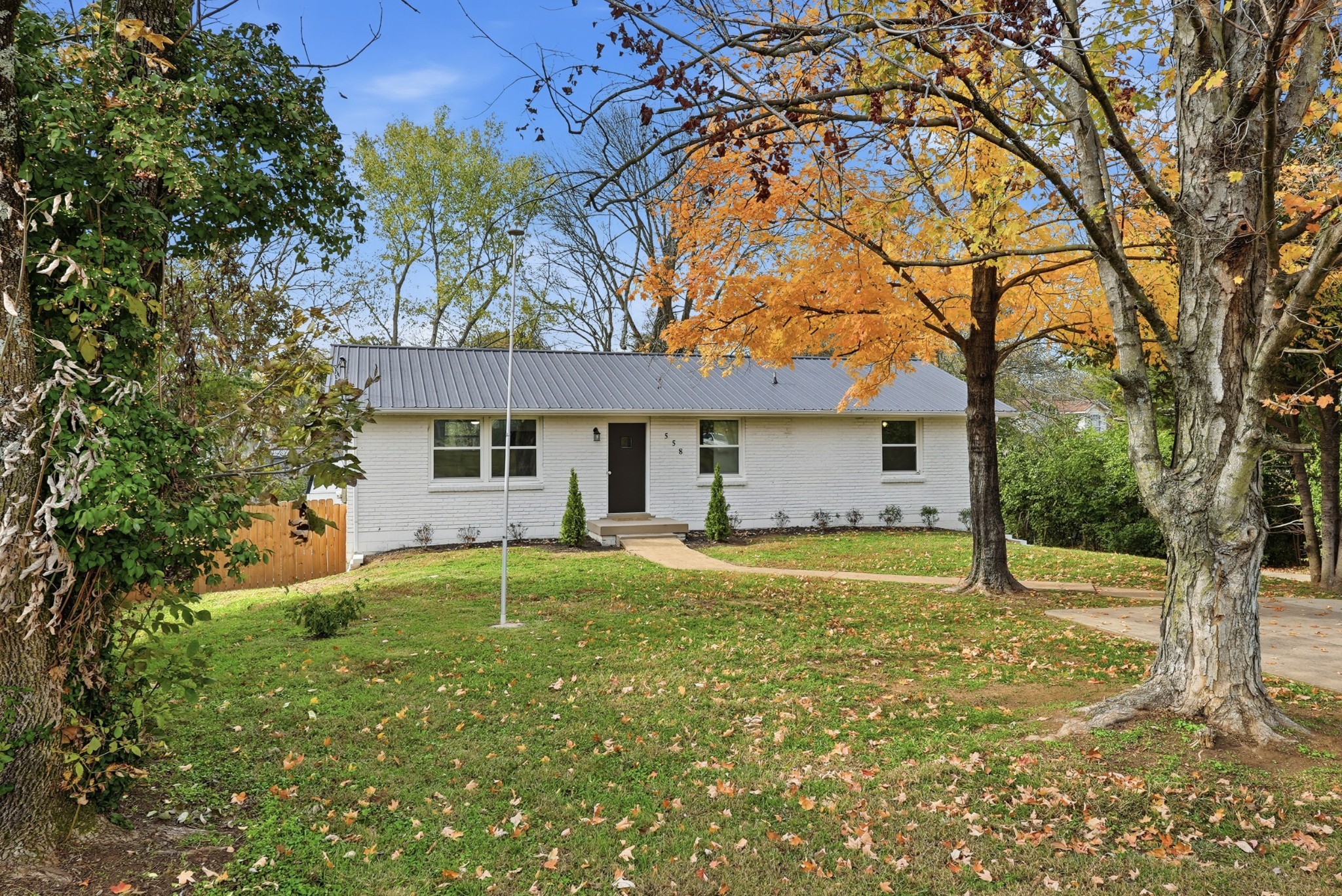 a house view with a sitting space and garden