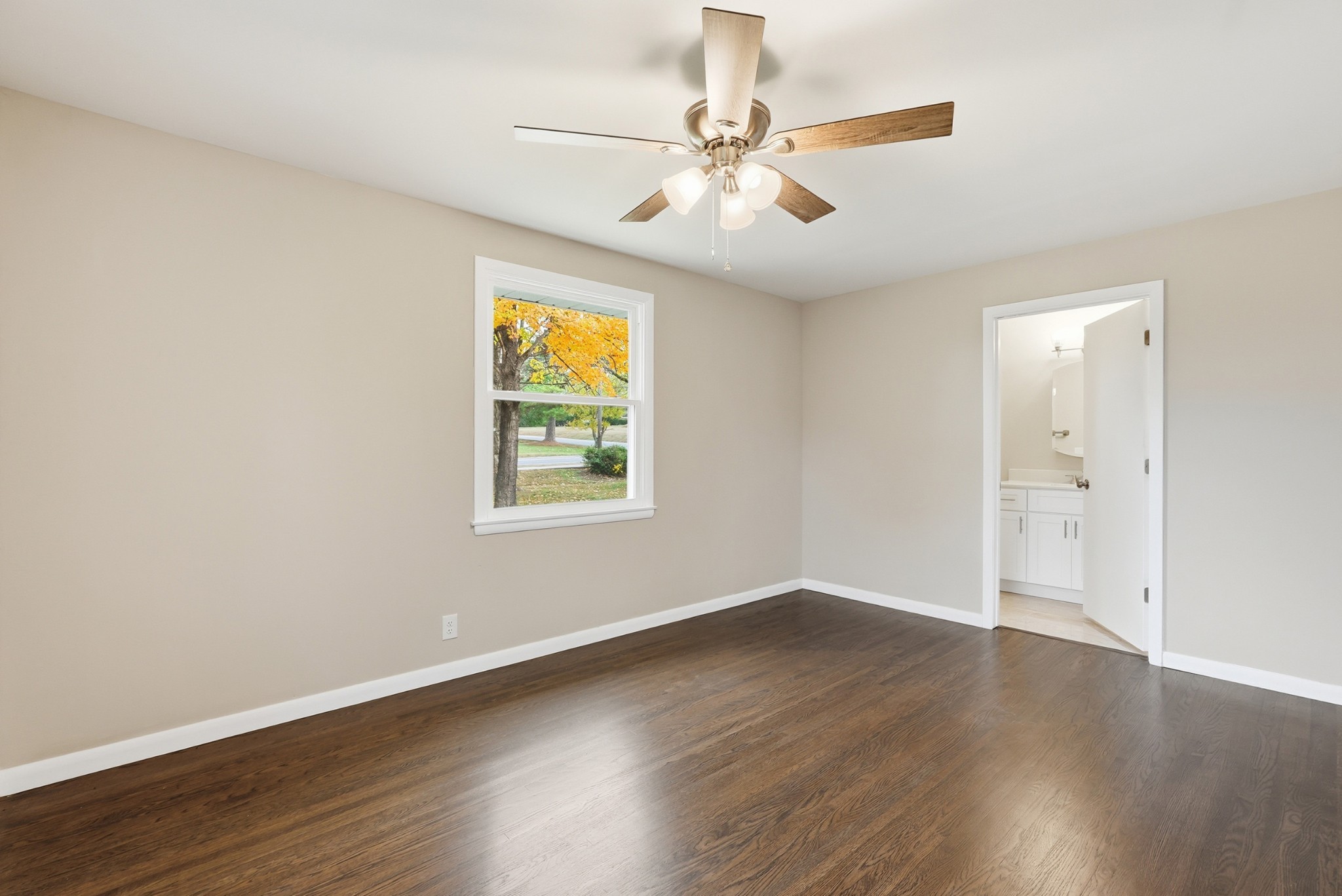 558 Walton Ferry Road Hendersonville, TN 37075 - Photo 12 of 28 an empty room with wooden floor fan and windows