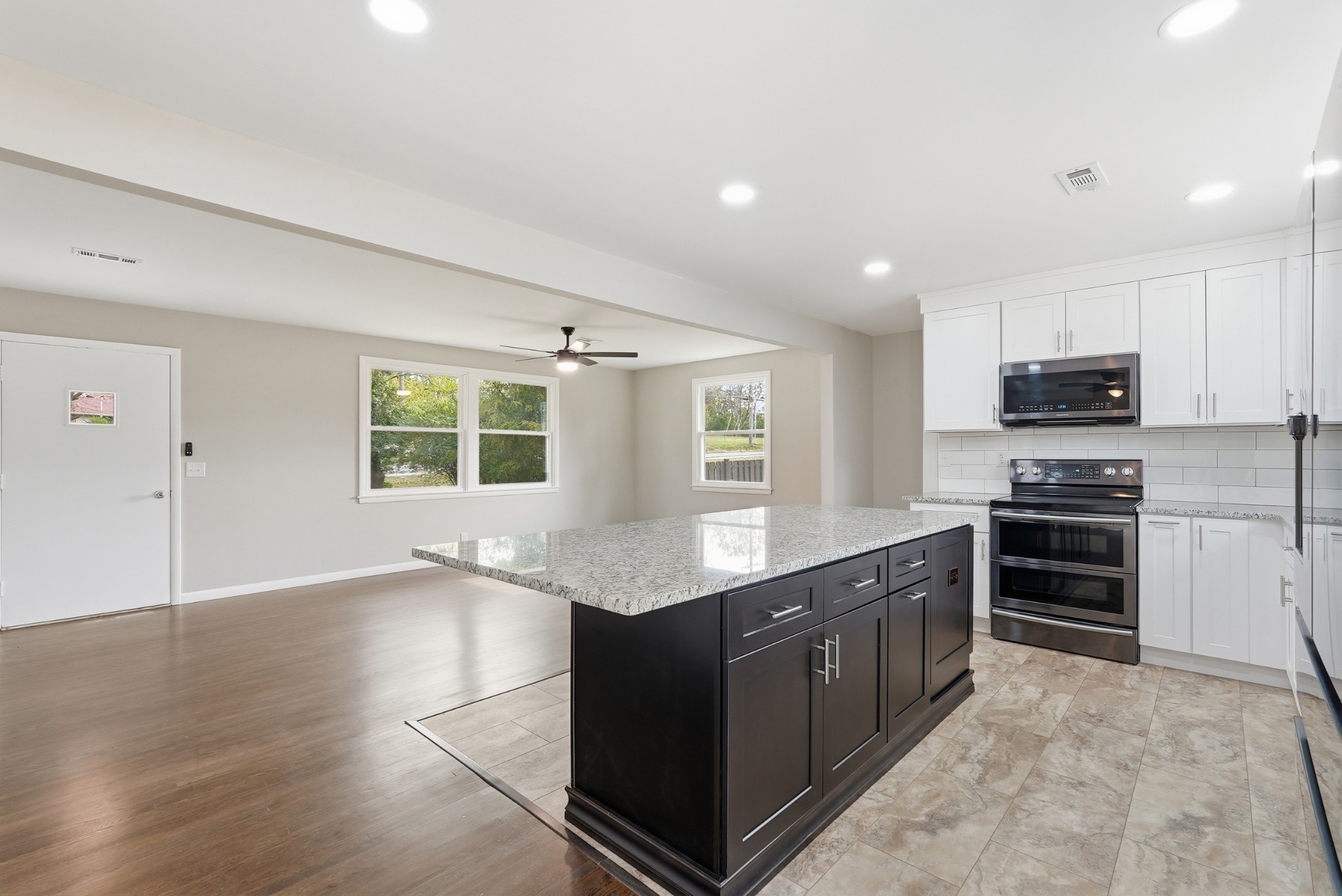 558 Walton Ferry Road Hendersonville, TN 37075 - Photo 7 of 28 a kitchen with stainless steel appliances granite countertop a stove a sink and a refrigerator