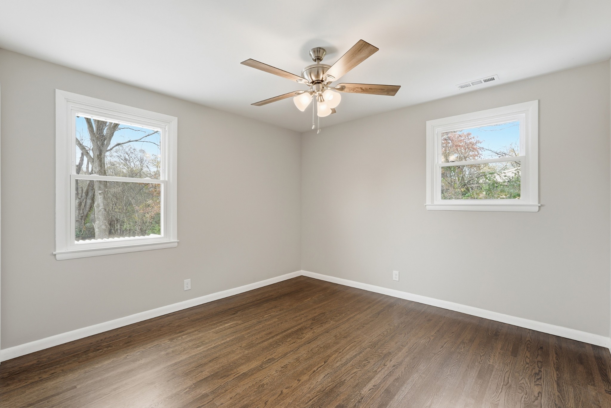 558 Walton Ferry Road Hendersonville, TN 37075 - Photo 9 of 28 a view of an empty room with wooden floor and a window