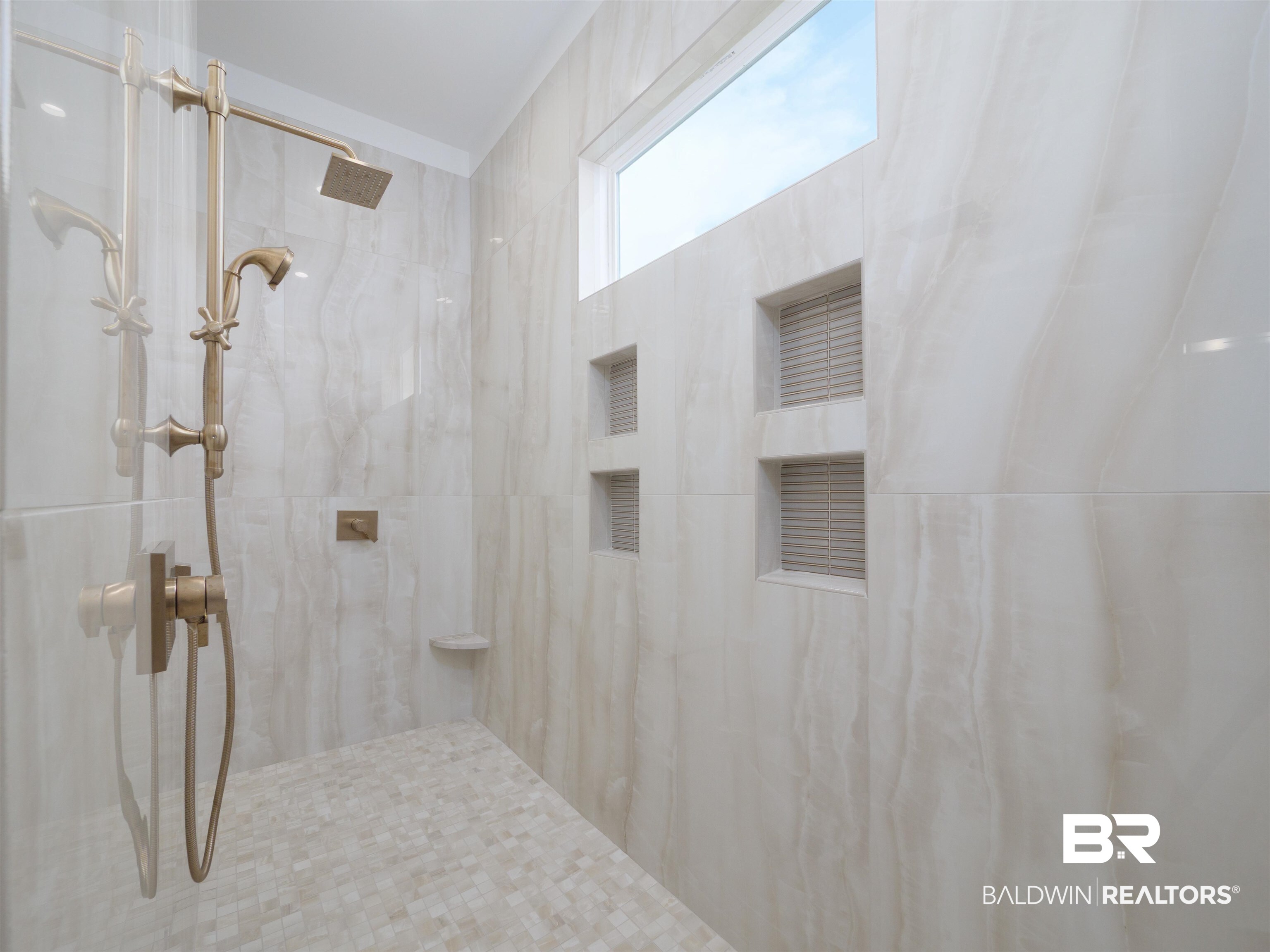 10912 Catania Avenue Fairhope, AL 36532 - Photo 22 of 54 Primary shower with dual entry, showerheads, product shelves, and leg rests.