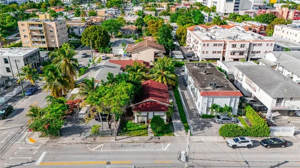 a view of building with garden space and street view