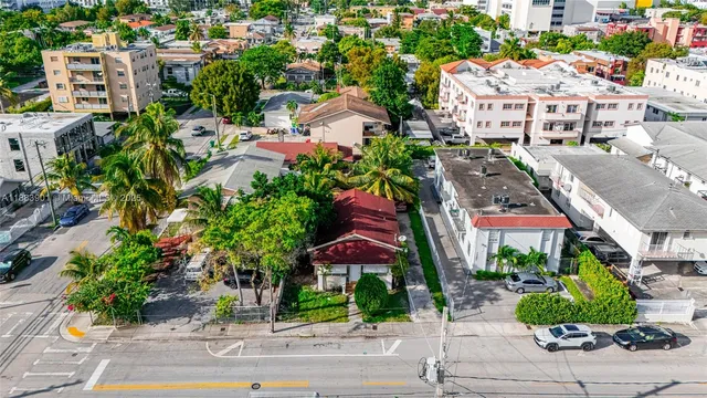 a view of building with garden space and street view