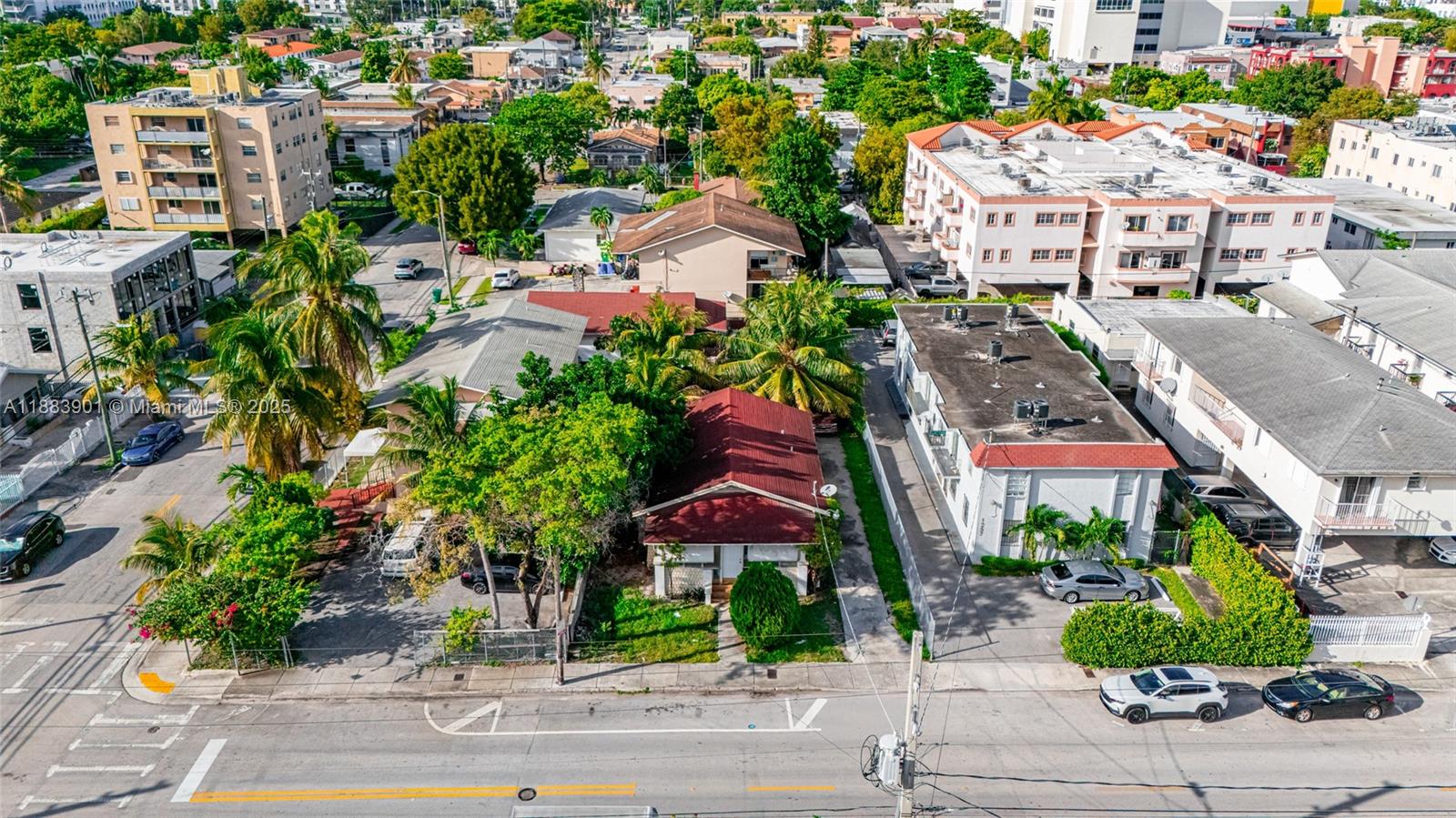 1267 Northwest 3rd Street Miami, FL 33125 - Photo 11 of 20 a view of building with garden space and street view