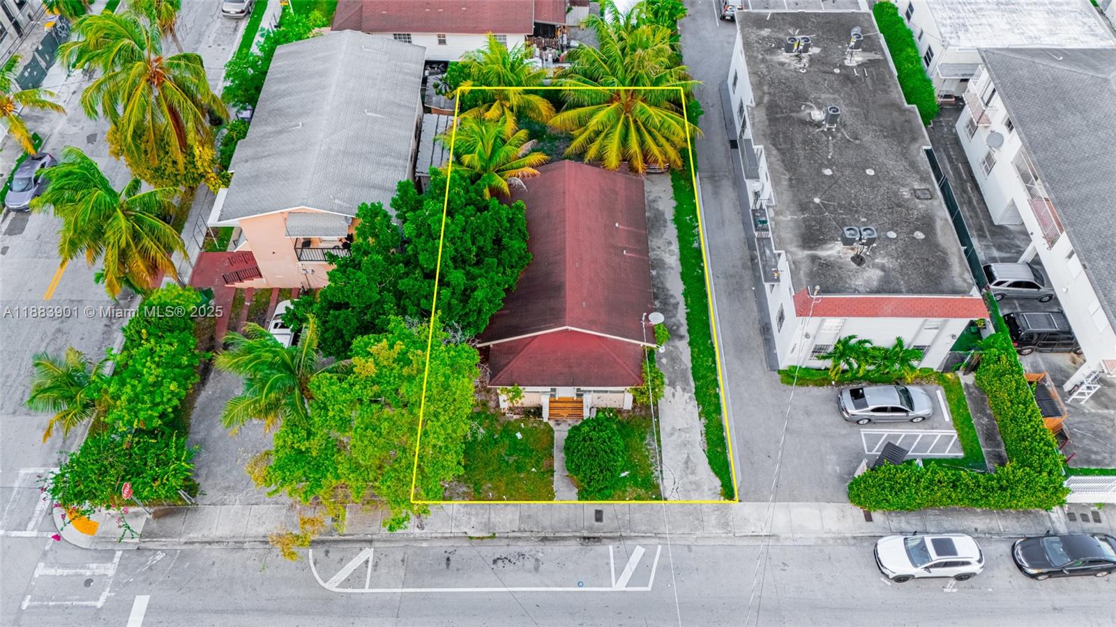 1267 Northwest 3rd Street Miami, FL 33125 - Photo 3 of 20 an aerial view of a house with a yard and potted plants