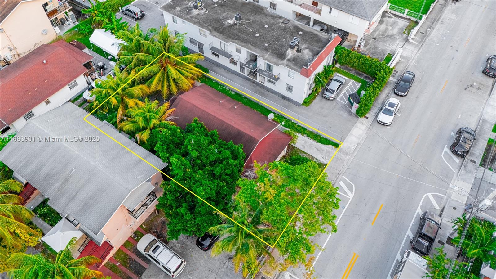 1267 Northwest 3rd Street Miami, FL 33125 - Photo 6 of 20 an aerial view of a house with a yard and garden