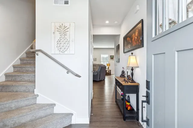 a view of a hallway with seating area