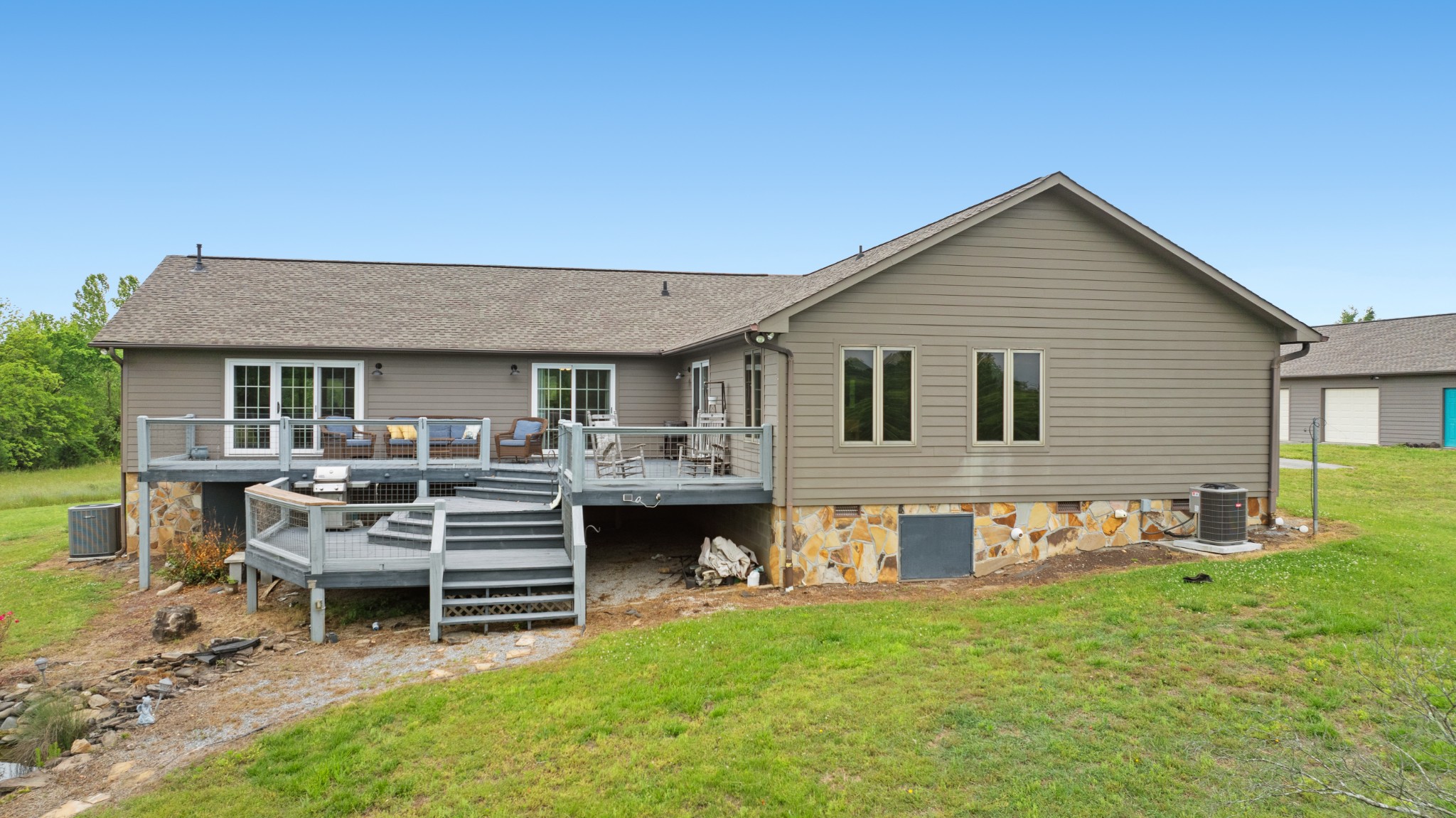 6052 Morganton Road Greenback, TN 37742 - Photo 44 of 54 a view of a house with a backyard and chairs