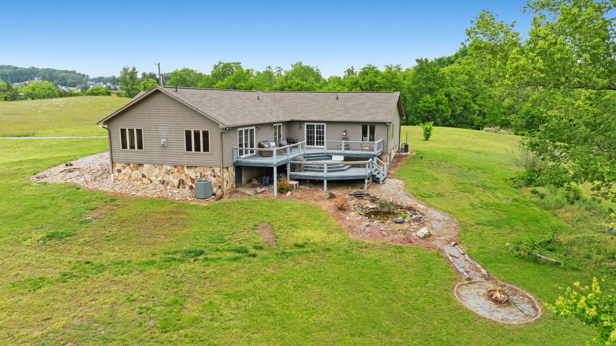 6052 Morganton Road Greenback, TN 37742 - Photo 45 of 54 a aerial view of a house with table and chairs under an umbrella