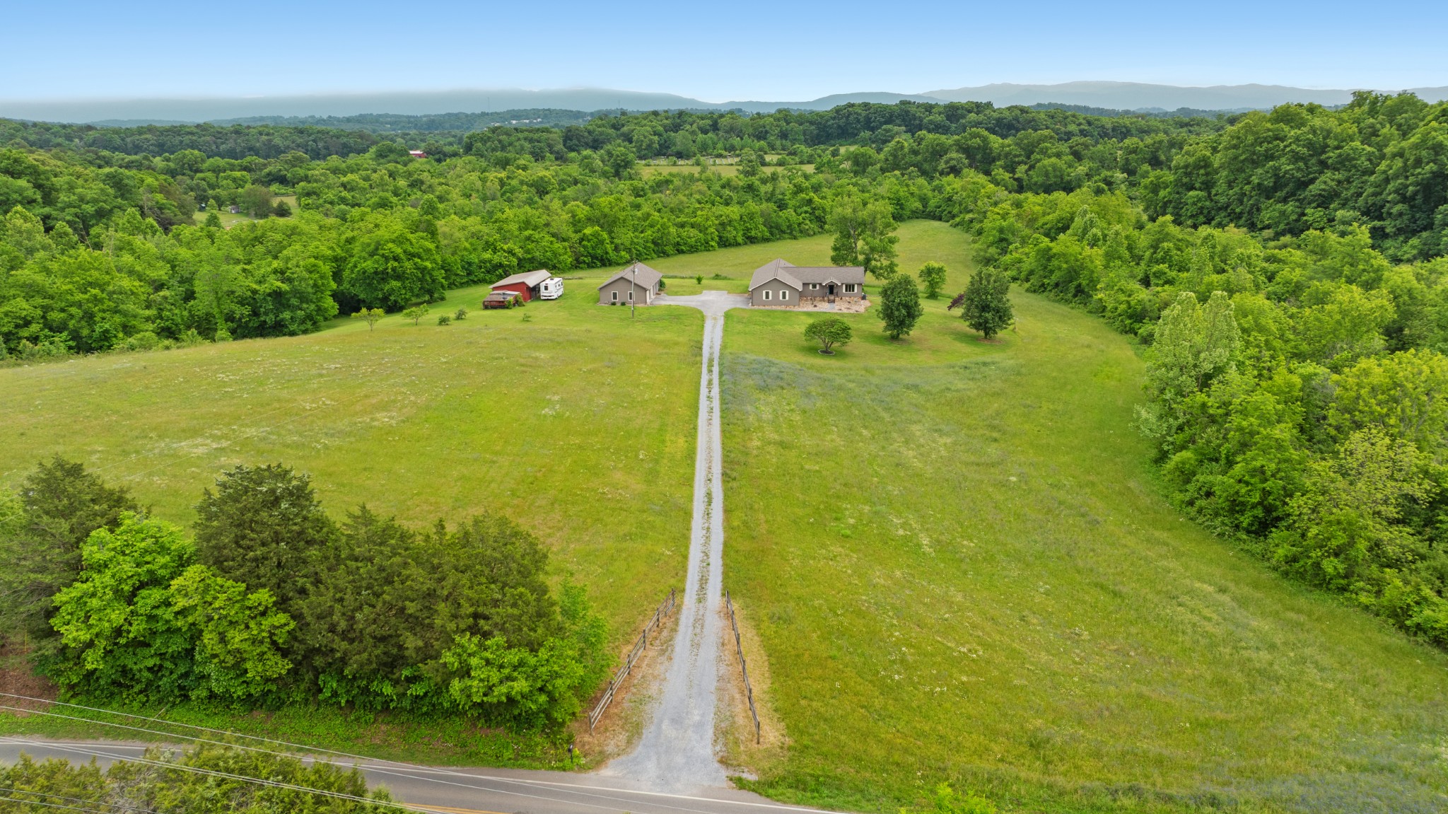 6052 Morganton Road Greenback, TN 37742 - Photo 49 of 54 a view of a garden with a building in the background