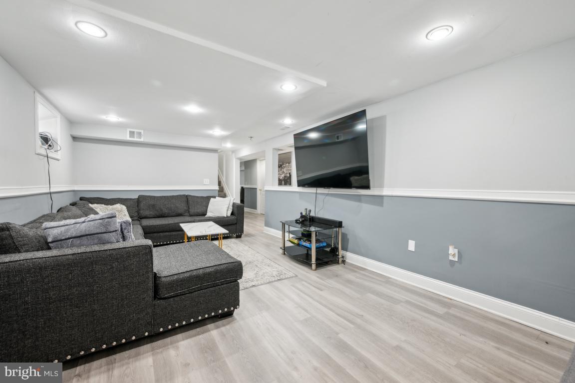 717 Bem Street Riverside, NJ 08075 - Photo 17 of 27 a living room with furniture and a flat screen tv