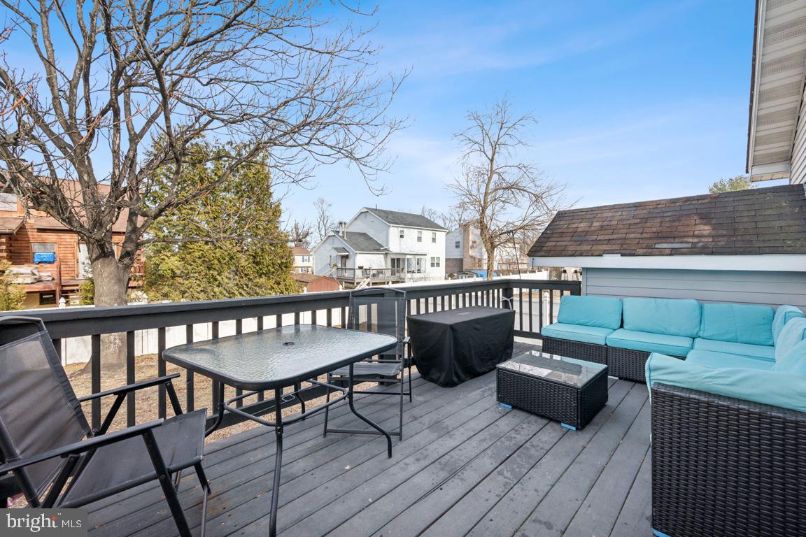 717 Bem Street Riverside, NJ 08075 - Photo 25 of 27 a view of a chairs and table on the roof deck