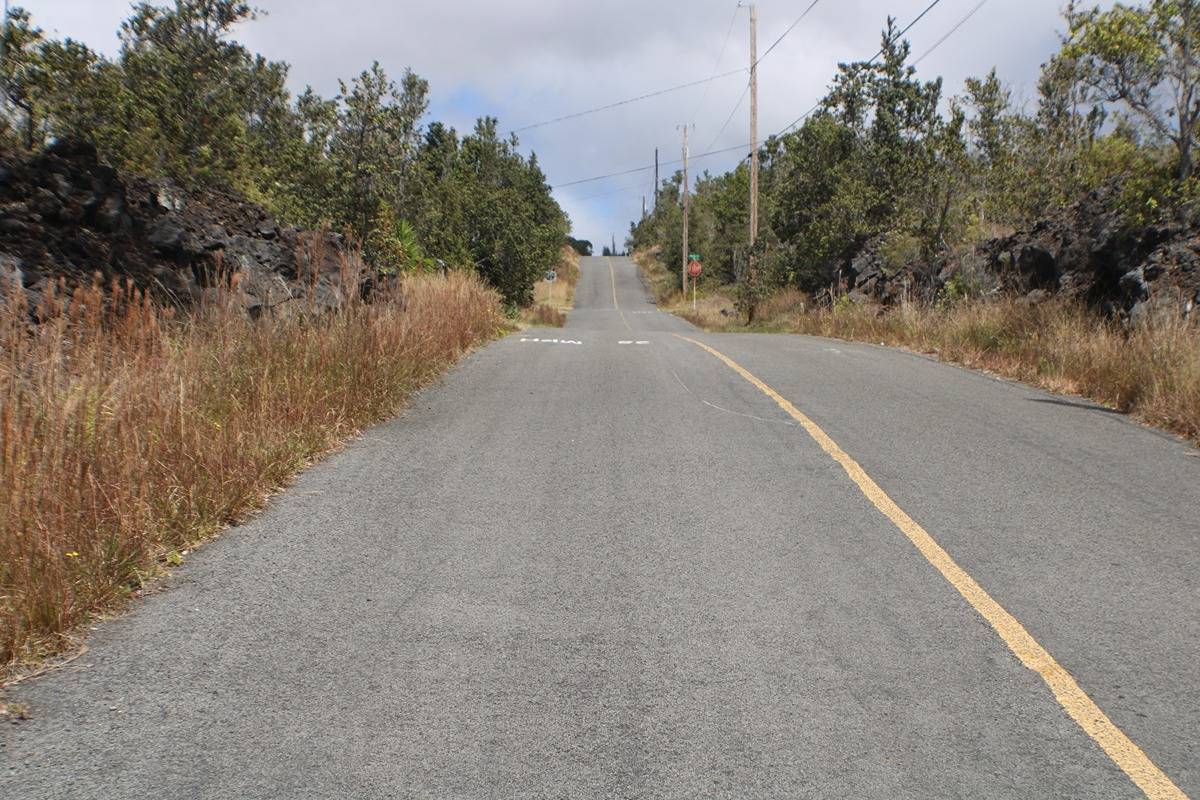 14 Bamboo Lane Ocean View, HI 96704 - Photo 15 of 17 a view of a road with a building in the background