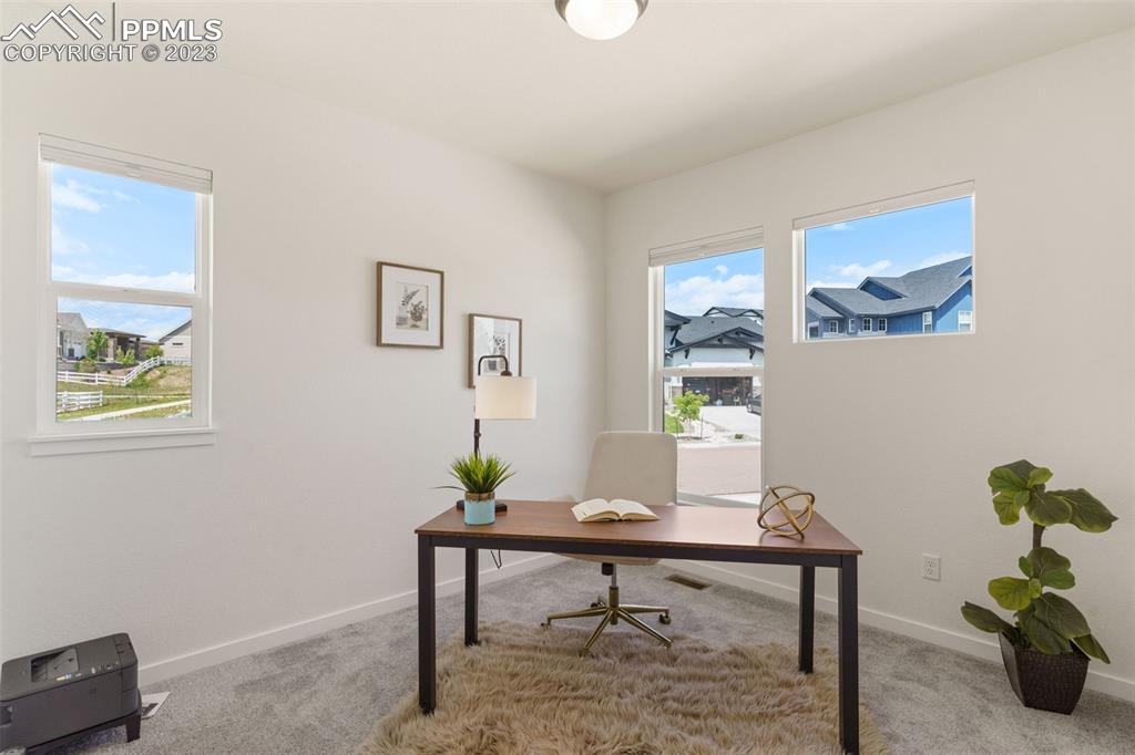 11969 Alydar Loop Colorado Springs, CO 80921 - Photo 19 of 44 a view of a workspace with furniture