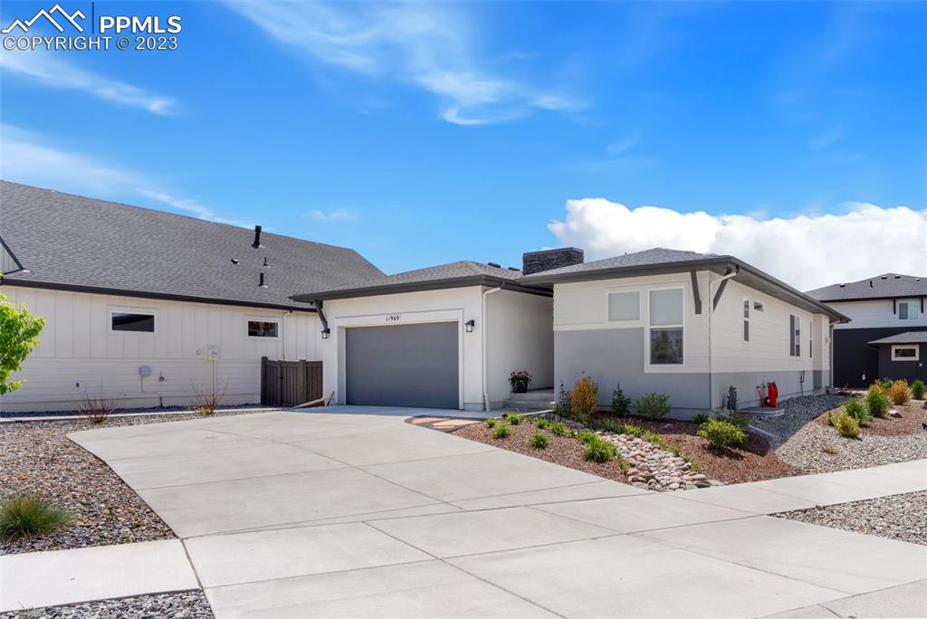 11969 Alydar Loop Colorado Springs, CO 80921 - Photo 2 of 44 a front view of a house with a garage